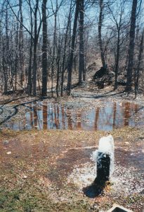 Image of a flowing water well