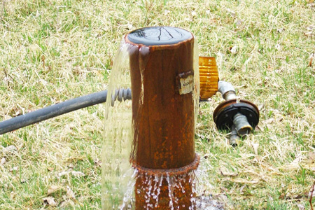 Image of a flowing water well